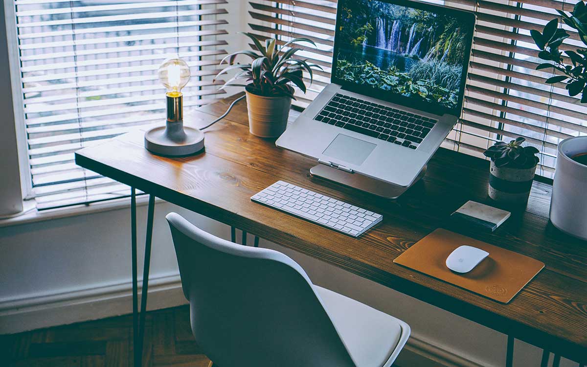 MacBook on desk in home office