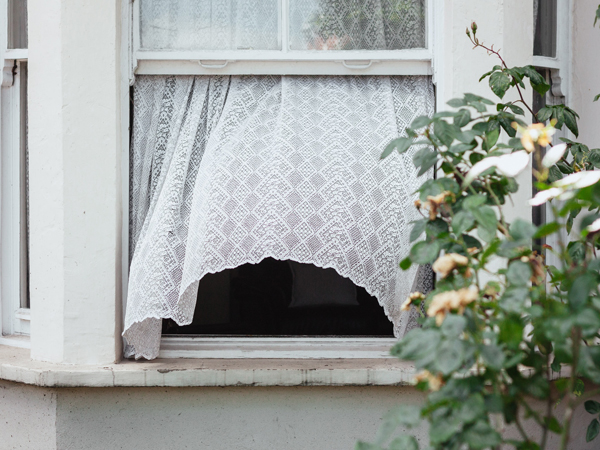 Open window with breeze blowing, keeping a house cooler