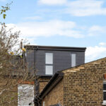Exterior view of dormer loft conversion in black